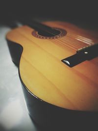 Close-up of guitar on table