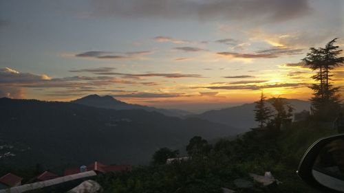Scenic view of mountains against sky during sunset