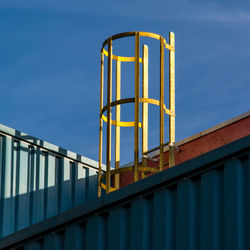 Low angle view of metallic structure on roof