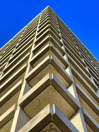 Low angle view of building against blue sky