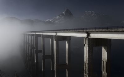 A scenic of a bridge and mountains