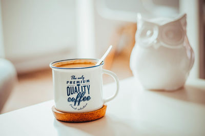 Close-up of coffee cup on table