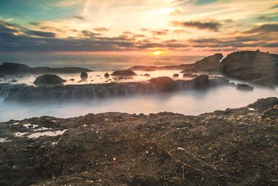 Scenic view of beach during sunset