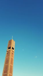 Low angle view of tower against clear blue sky