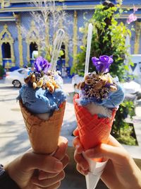 Cropped image of hand holding ice cream