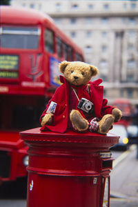 Close-up of stuffed toy in city