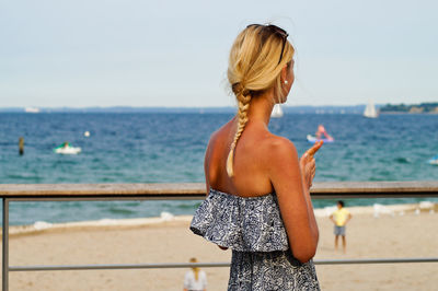 Woman standing on beach