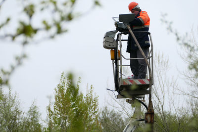 Repair of street lights on poles with a lifting platform. high quality photo