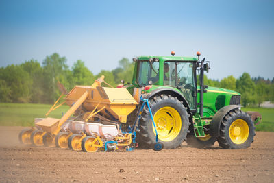 Tractor on field against sky