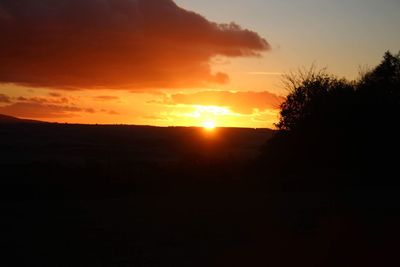 Scenic view of silhouette landscape against sky during sunset