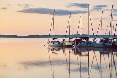 Yachts and boats moored in a harbour at sunrise. candid people, real moments, authentic situations