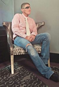 Young man sitting on chair