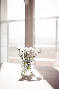 Flower vase on table at home