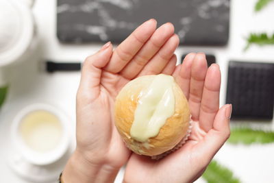 Close-up of hand holding ice cream