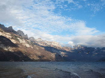 Scenic view of mountains against sky during winter