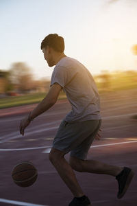 Teenager street basketball player