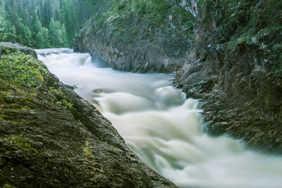 A beautiful scenery with a river rapids in finland