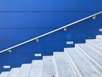 Staircase against blue wall 