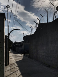 Street amidst buildings against sky