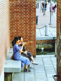 Couple sitting on staircase