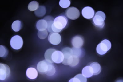 Defocused image of illuminated lights at night