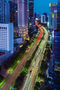 High angle view of light trails on road at night