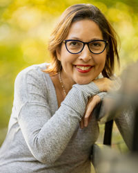Portrait of young woman sitting outdoors