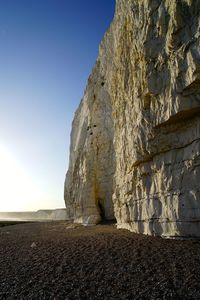 Rock formation on land against clear sky