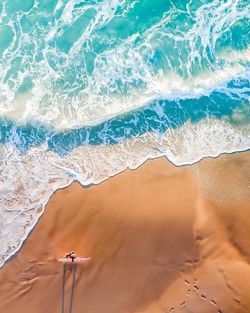 High angle view of woman walking at beach