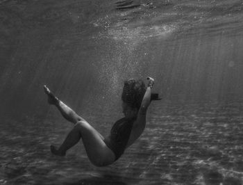 Full length of woman swimming in sea