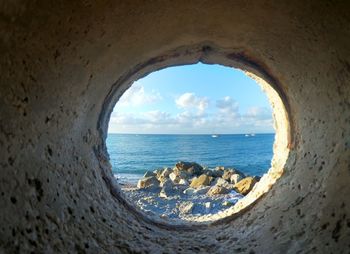 Scenic view of sea seen through window