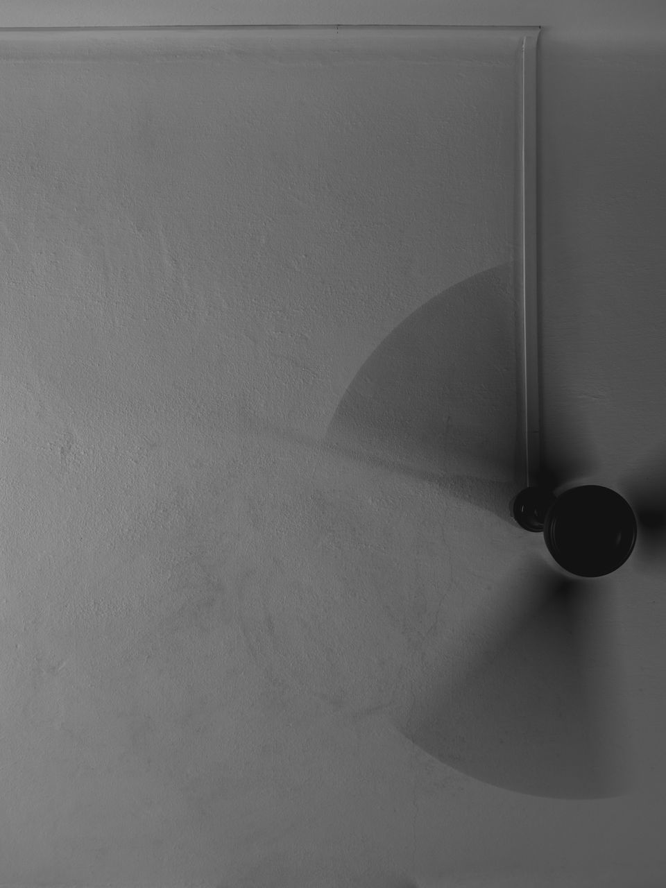 LOW ANGLE VIEW OF ELECTRIC LAMP ON CEILING