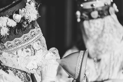 Ancient carnival of sauris. traditional wooden masks. black and white. italy