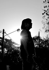 Man standing against sky during sunset