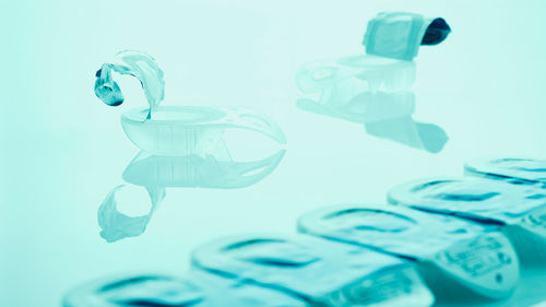 Close-up of contact lens cases on table