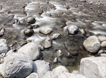 High angle view of pebbles on beach