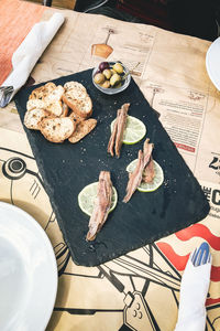 High angle view of bread on cutting board