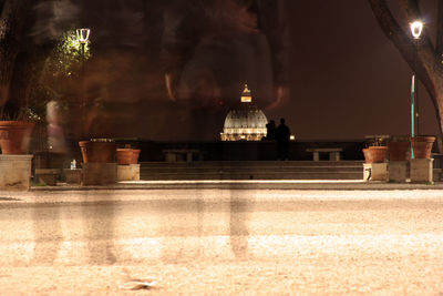 Illuminated building seen through glass at night