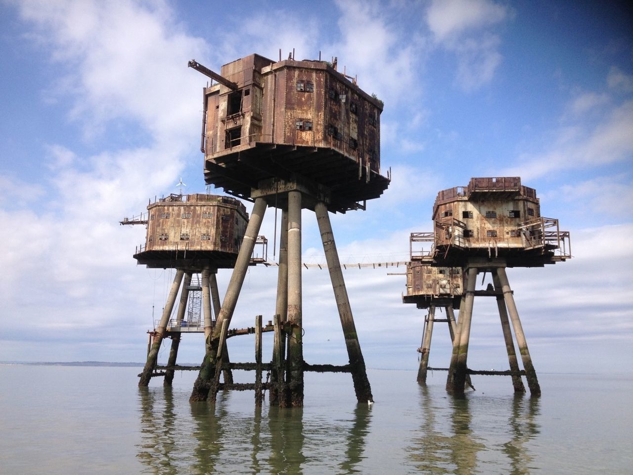 water, sky, sea, cloud - sky, built structure, architecture, old, horizon over water, abandoned, building exterior, cloud, obsolete, cloudy, outdoors, damaged, history, day, nature, beach, low angle view