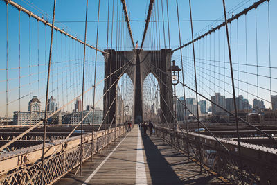 Low angle view of brooklyn bridge in city