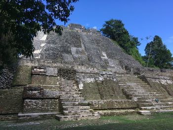 Low angle view of old ruin building against sky