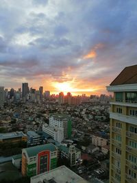 High angle view of buildings against sky during sunset