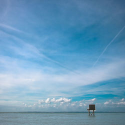 Scenic view of sea against blue sky