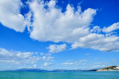 Scenic view of sea against blue sky