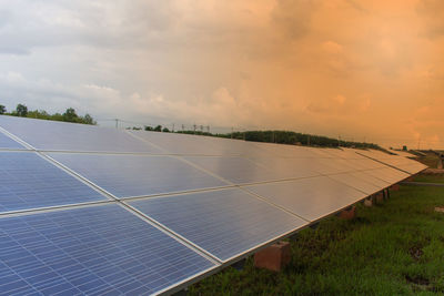 Scenic view of field against sky during sunset