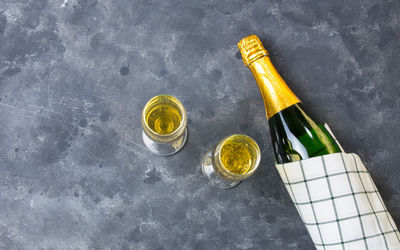 High angle view of wine bottles on glass