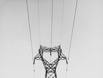 Low angle view of metal against sky