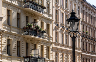 Low angle view of street light against building