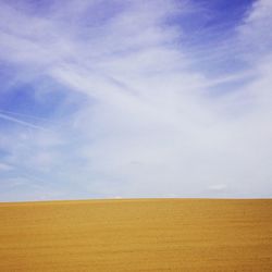 Scenic view of landscape against cloudy sky