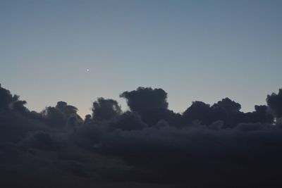 Low angle view of silhouette trees against sky at sunset